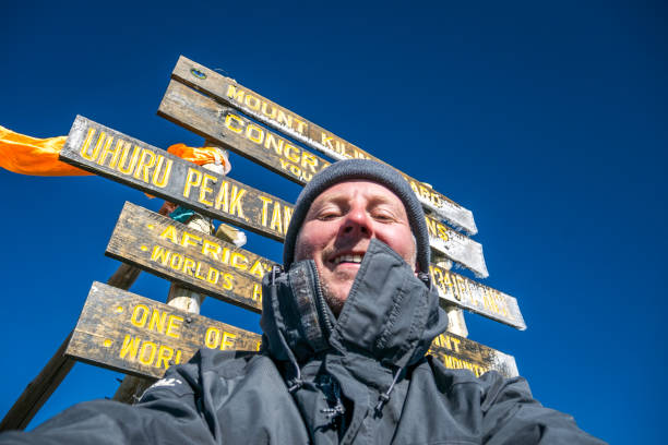 Man at Uhuru Peak, Mount Kilimanjaro, Tanzania